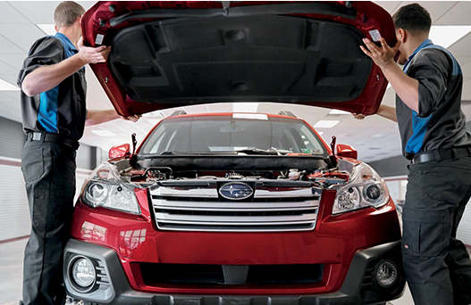 Moyer Collision Repair technicians working on a vehicle
